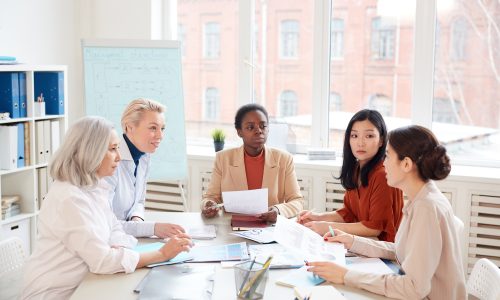 Group of Businesswomen at Meeting in Office